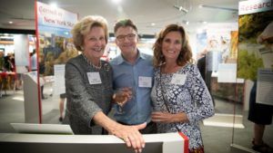 From left, Laura Treman Almquist ’56, her son, Arthur Almquist, and daughter-in-law, Amy Almquist, check out the exhibit space in the Martin Y. Tang Welcome Center.