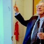 Isaac Kramnick, the Richard J. Schwartz Professor of Government Emeritus, cuts the ribbon on the Olin Library study dedicated in his honor.