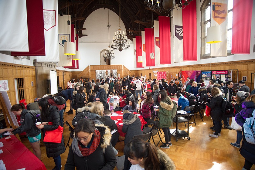 Students, faculty, and staff in the Memorial Room of Willard Straight Hall