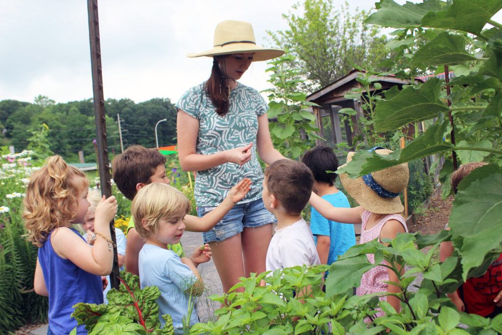 Hopkins-Hensley working with local kids in the Ithaca Childrens Garden as part of her horticulture internship in summer 2017.