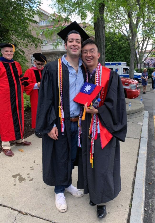 Will Gusick (left) and Dustin Liu (right) at graduation wearing their cords.