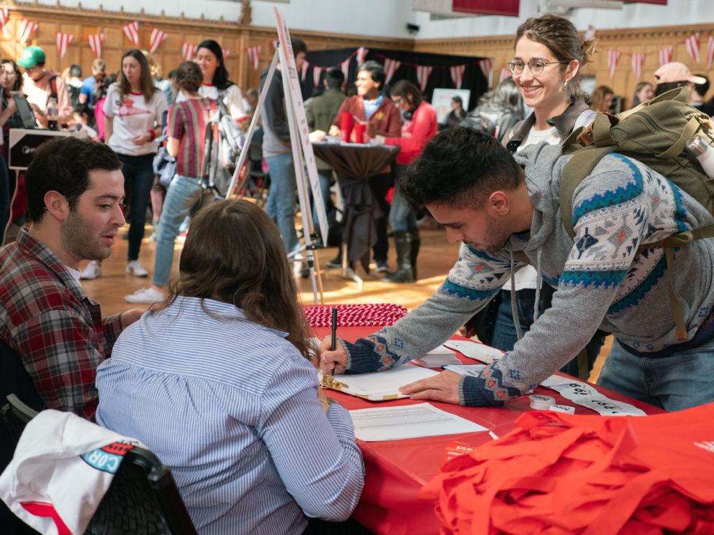 Seniors making gifts at the SCC table on Giving Day.