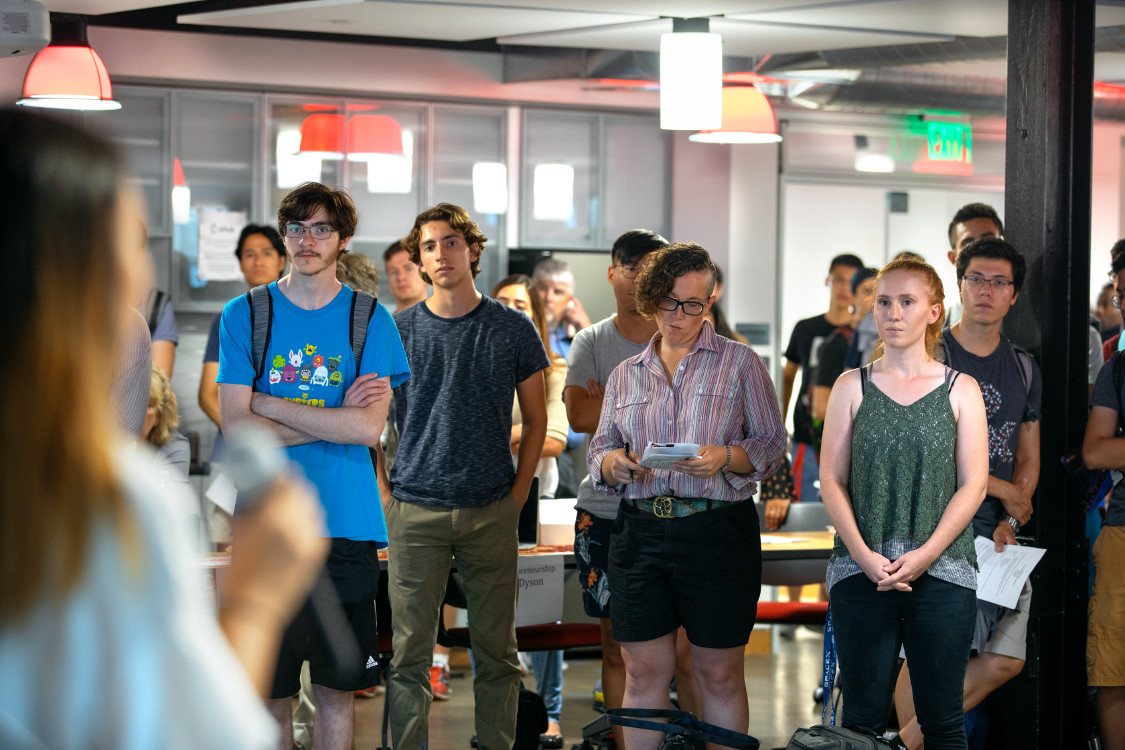 Students listen to a speaker.