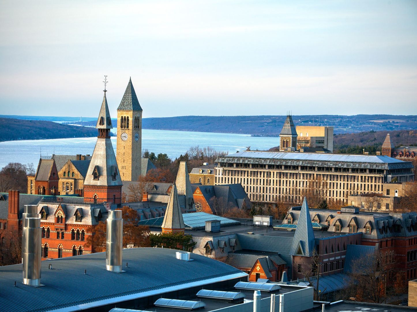 Central campus in fall, with Sage Hall, McGraw Tower, and Cayuga Lake