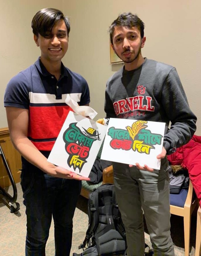 Umran and a fellow Bangladeshi student display the paintings they created at the ‘Chai and Paint’ Bengali Students Association event.