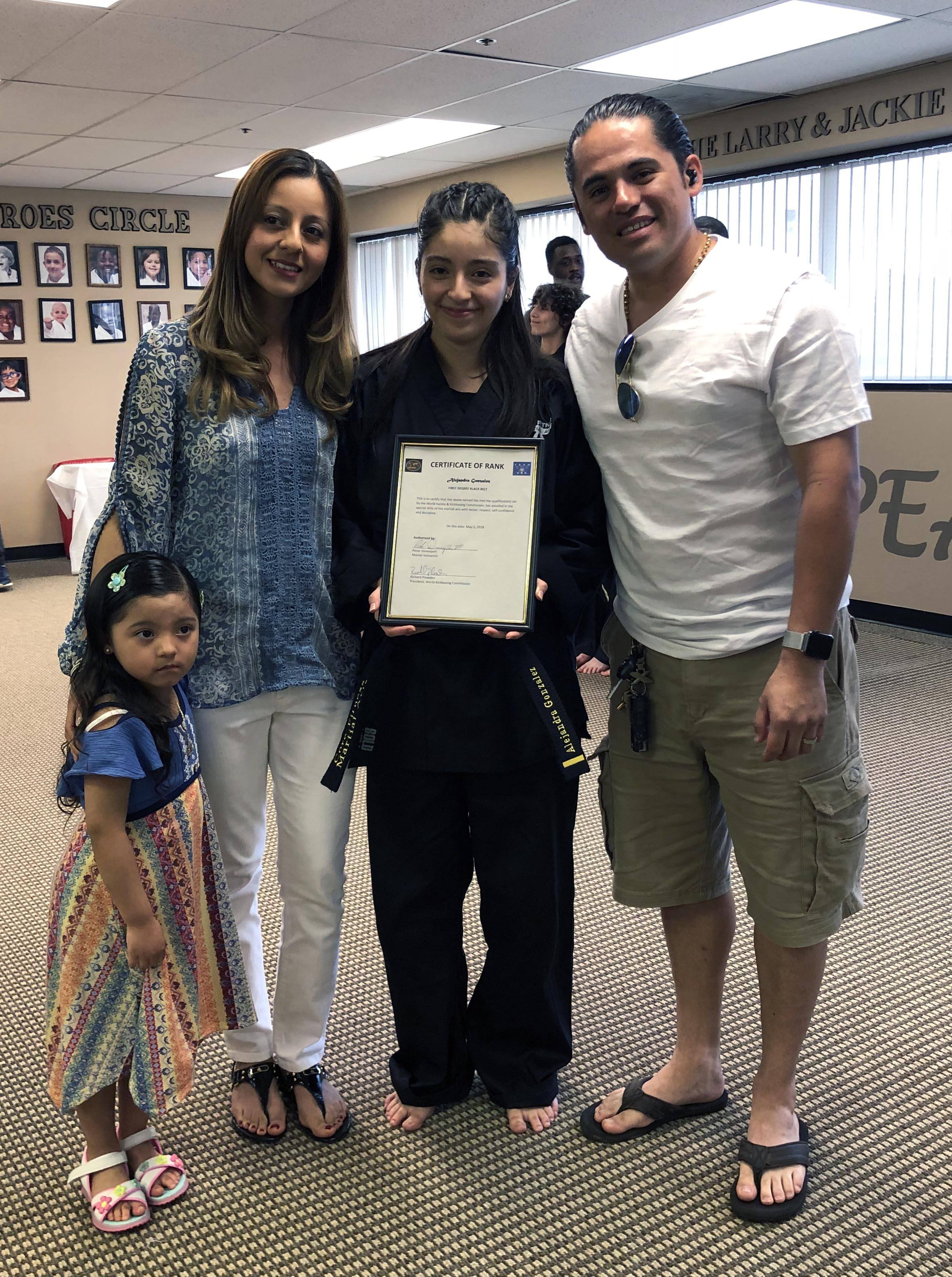 (L to R) Megan Gonzalez (sister), Noemi Rivera (mother), Alejandra Gonzalez, Alejandro Gonzalez (father). Alejandra received her first-degree black belt in karate in May 2018.