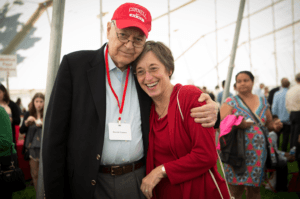 harold tanner hugs susan murphy while posing for a photo