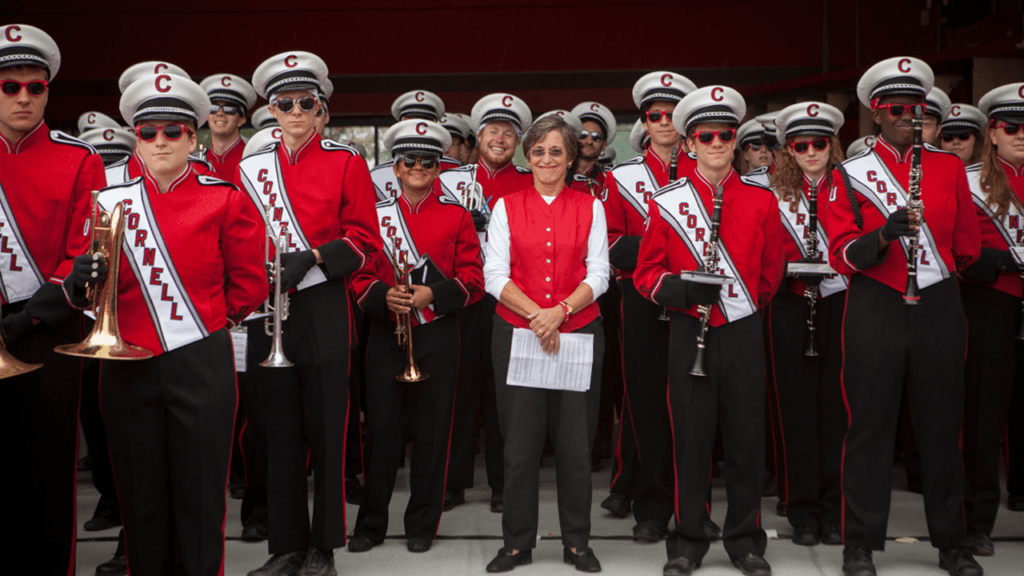 susan murphy stands with the big red band