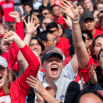 Cornell students cheer on the Big Red football team in 2018