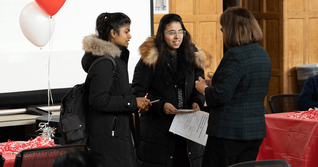 Cornell students talk with President Martha E. Pollack during a Giving Day event