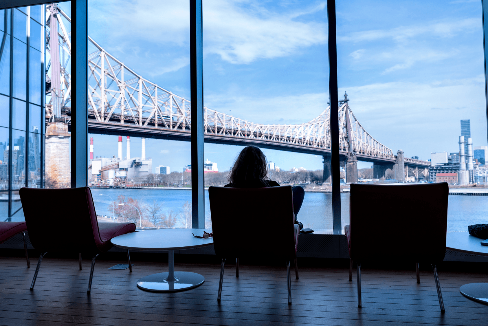 A student enjoys the view from the Tata Innovation Center at Cornell’s Tech Campus in New York City