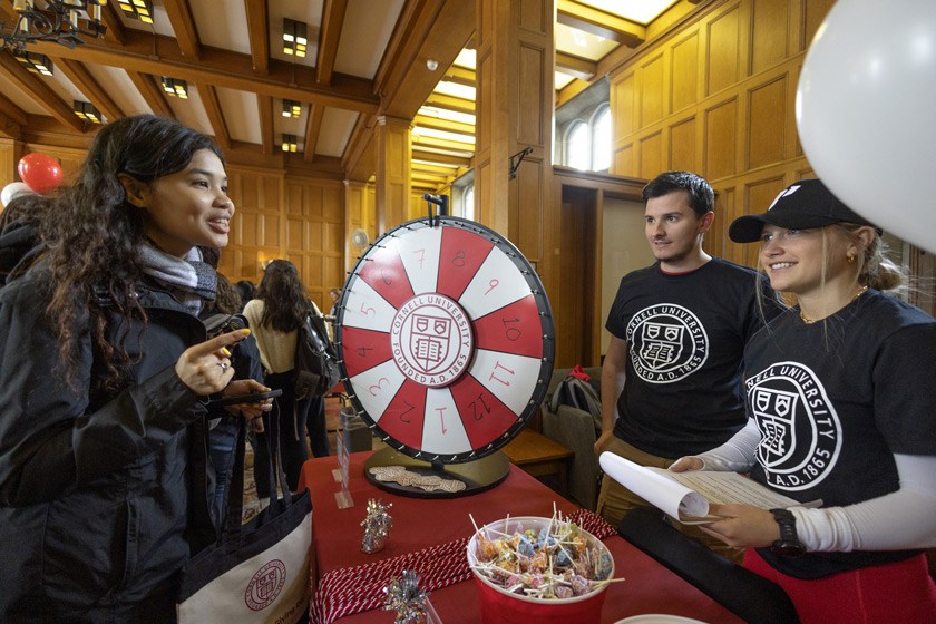 Lauren Pappas and Patrick J. Mehler tabling at the on-campus Giving Day event. The SCC shares fun perks like special ‘philanthropy’ graduation cords, shown here, and free professional headshots for seniors who make a gift.