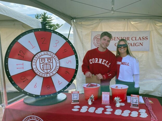Senior Class Campaign co-chairs Daniel Morgan and Lauren Pappas staffing the SCC table during Homecoming 2022