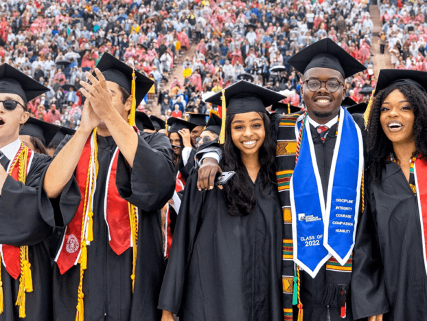 Cornell graduates celebrating during commencement