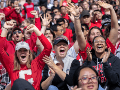Students cheer on the Cornell Men's football team at Schoellkopf Field