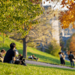 Students gather on Libe Slope on a fall day