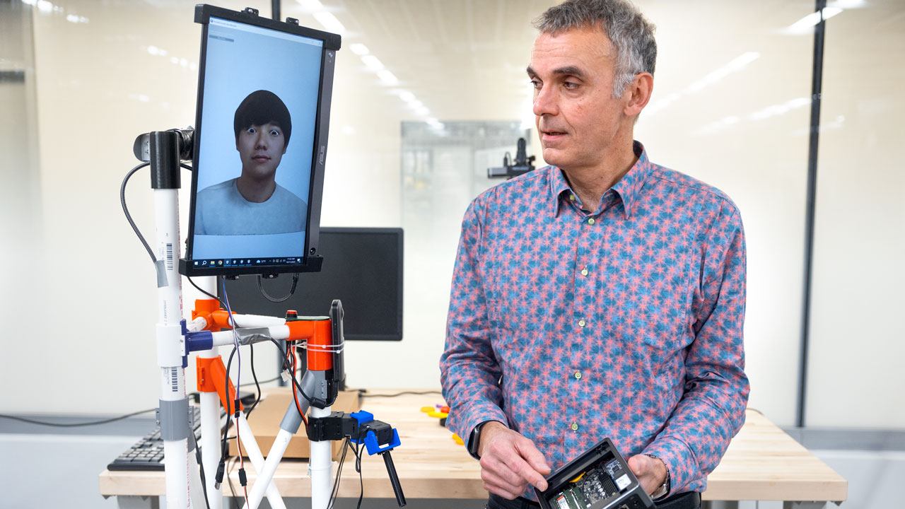 François Guimbretière, professor of information science in Cornell Bowers CIS, stands by the VRoxy robotic system.