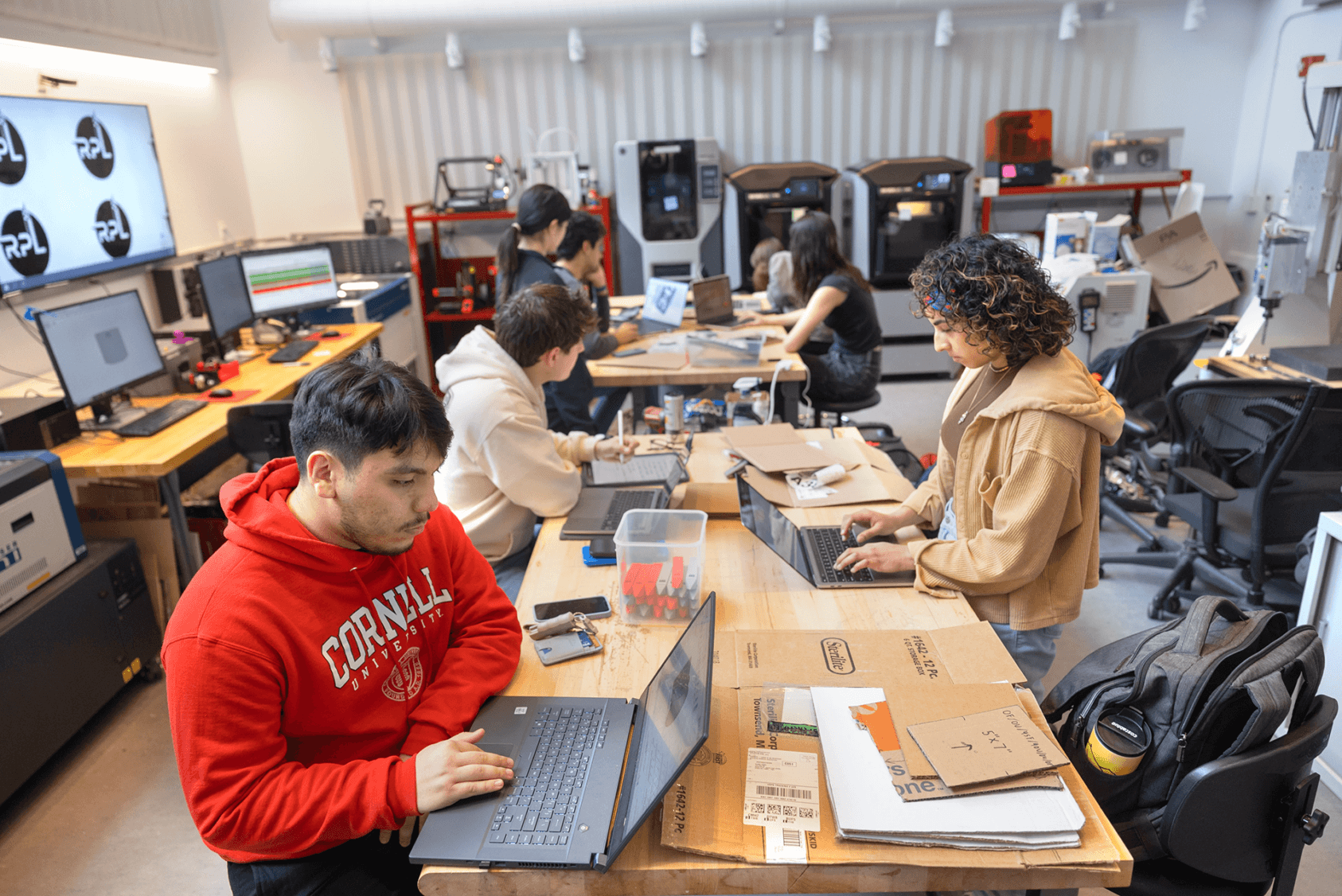 Engineering Project Teams’ students working in Rapid Prototyping Lab in Upson Hall.