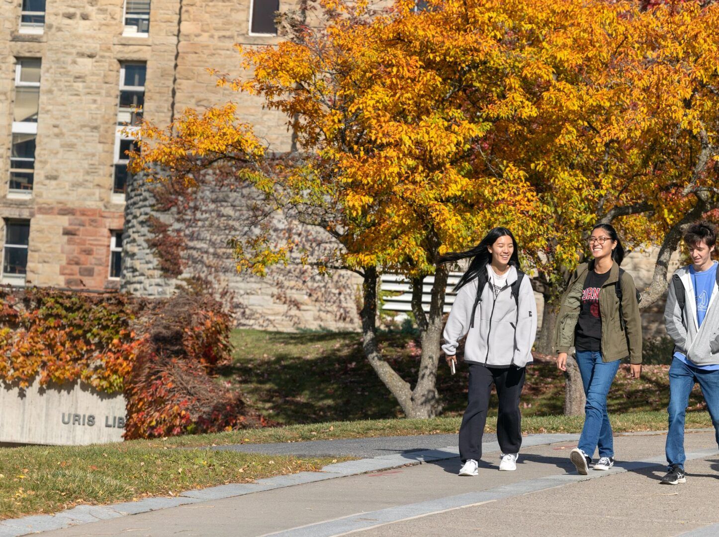 Students walk near Uris Library.