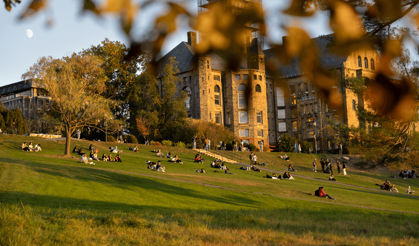 Students enjoy Libe slope during an autumn sunset.