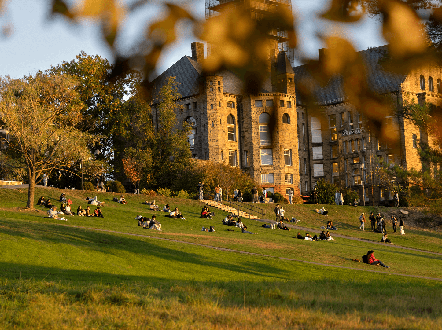 Students enjoy Libe slope during an autumn sunset.