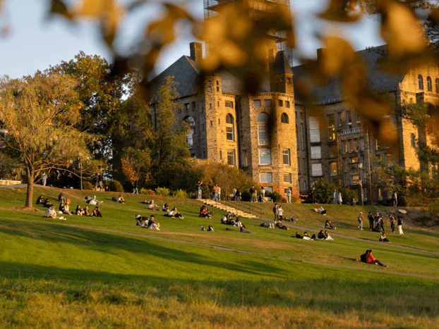 Students enjoy Libe slope during an autumn sunset.