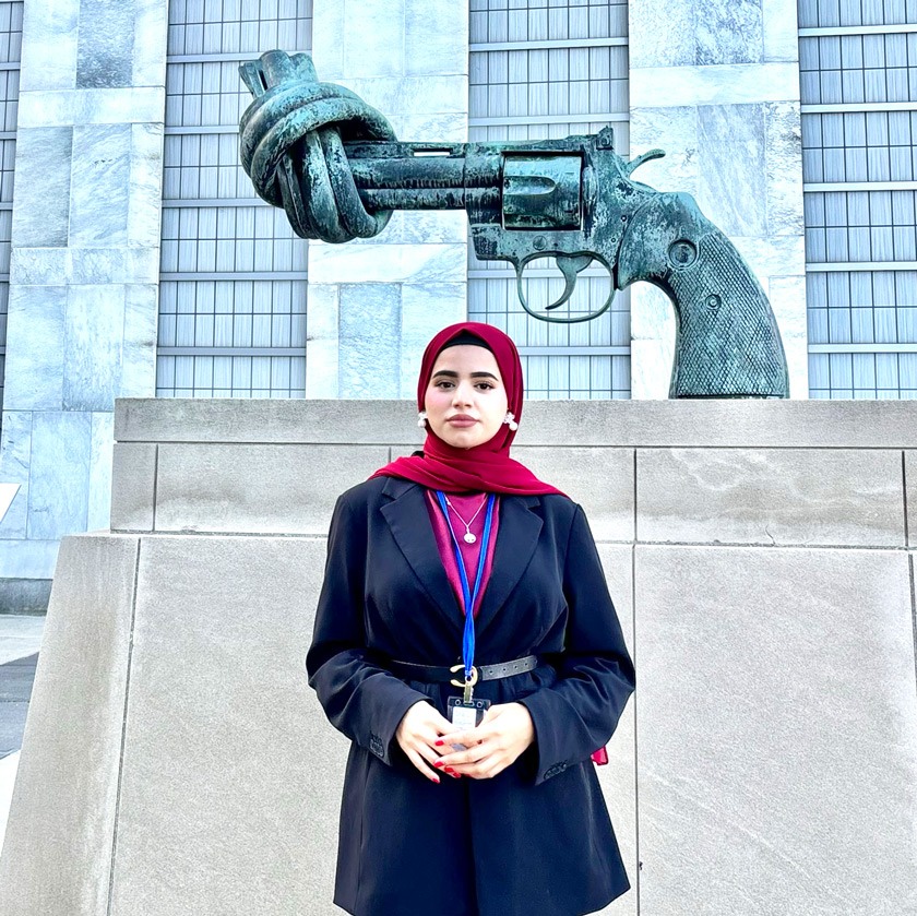 Mursal stands in front of “The Knotted Gun” sculpture outside the UN headquarters in NYC. Swedish artist Carl Fredrik Reuterswärd created artwork in honor of John Lennon, as a tribute to the musician and his vision for world peace.