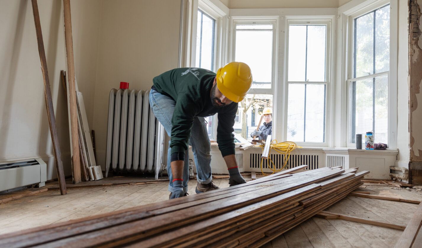 Faculty and students work on the deconstruction of a house