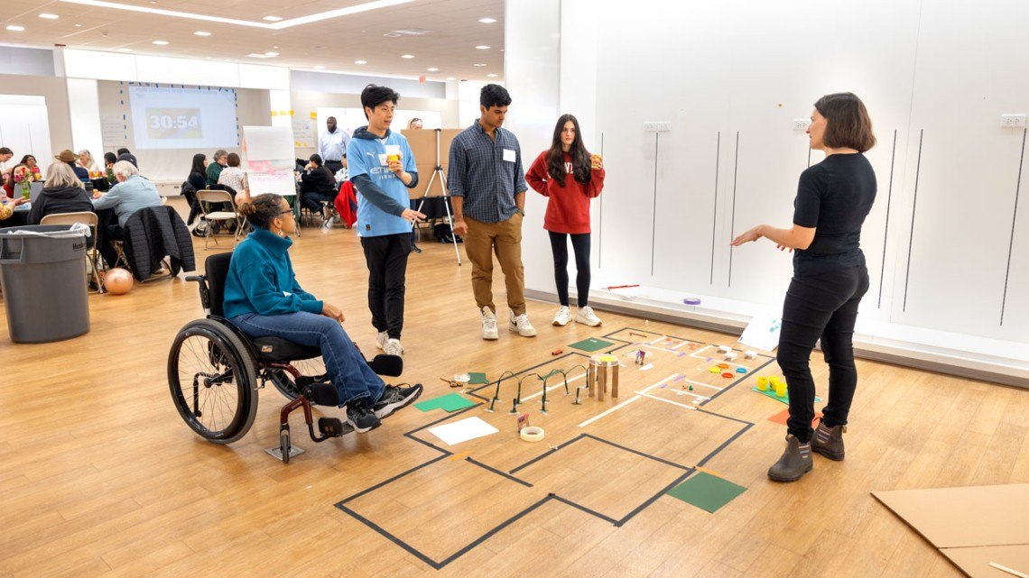 Faculty, students, and community members collaborating at shopping mall