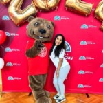 Vianny Lara ’25 poses for a photo with Touchdown on Giving Day 2024.