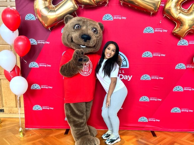 Vianny Lara ’25 poses for a photo with Touchdown on Giving Day 2024.