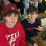 Bixby attends a Cornell hockey game with his roommate, Alex Milozewski '27.