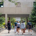 Students walk towards the Ives courtyard at the ILR School.