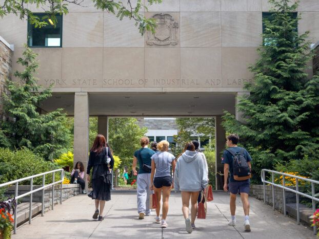 Students walk towards the Ives courtyard at the ILR School.
