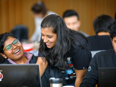 Students collaborate during a project work session at Cornell Bowers.