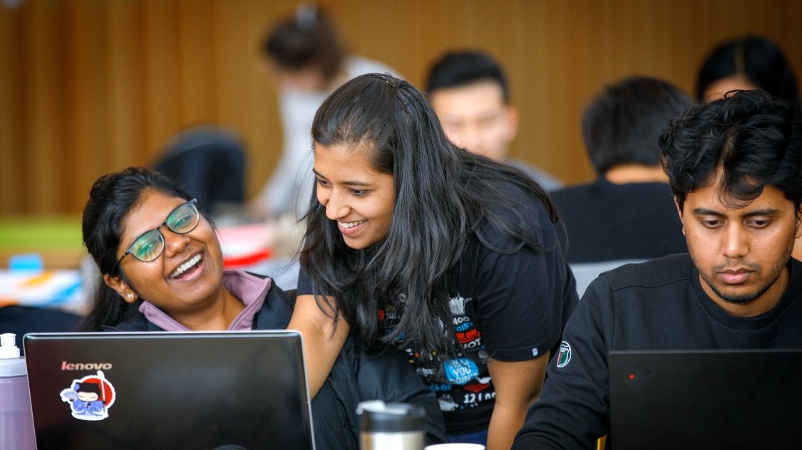 Students collaborate during a project work session at Cornell Bowers.
