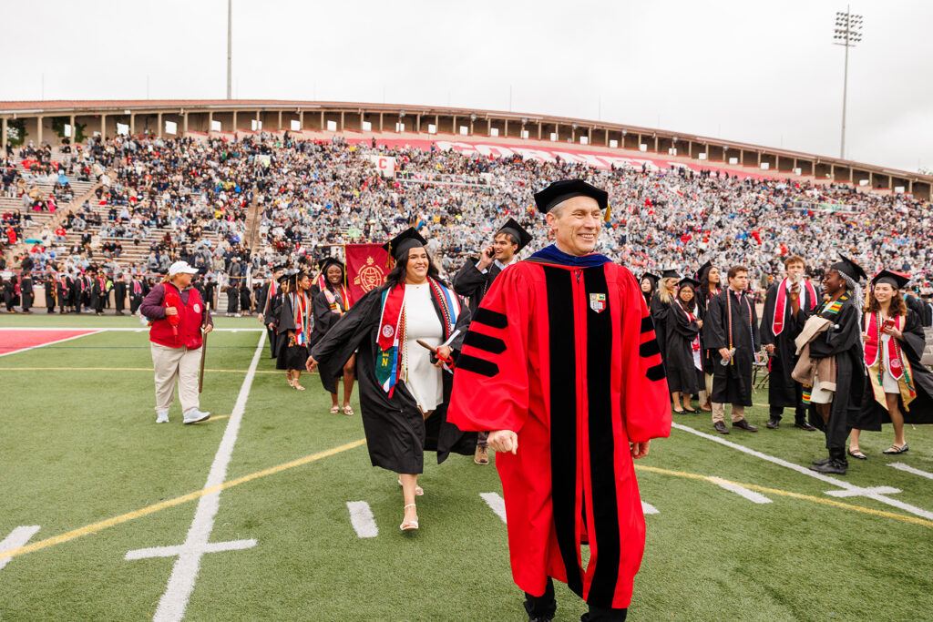 Alexander J. Colvin, Kenneth F. Kahn Dean of the School of Industrial and Labor Relations processes into Schoellkopf Field Cornell Commencement 2025