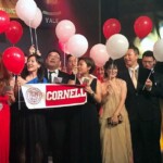 Isaac Wong '00 (2nd from right in gold tie) and his wife Cecilia (in gold dress) join other Cornellians at the 2017 Ivy Ball at the Hong Kong Convention Center.