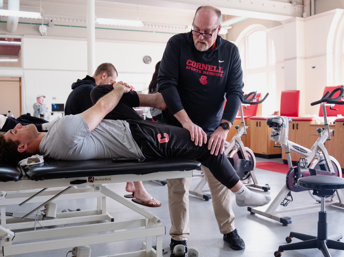student working with a sports medicine professional